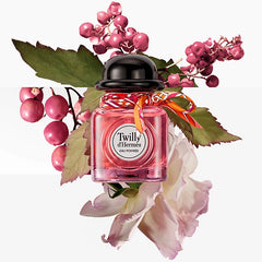 Hermès Twilly Eau Poivre 30ml perfume bottle with pink ribbon, showcased in a beauty product image.