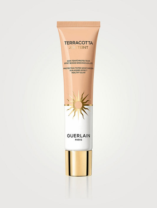 Guerlain Terracotta Joli Teint tinted moisturizer in shade NIB, providing a natural, glowing finish with light protection.