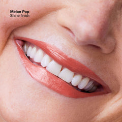 Clinique Pop Longwear Lipstick in various shades, new in box, featuring sleek white packaging and vibrant lipstick swatches.